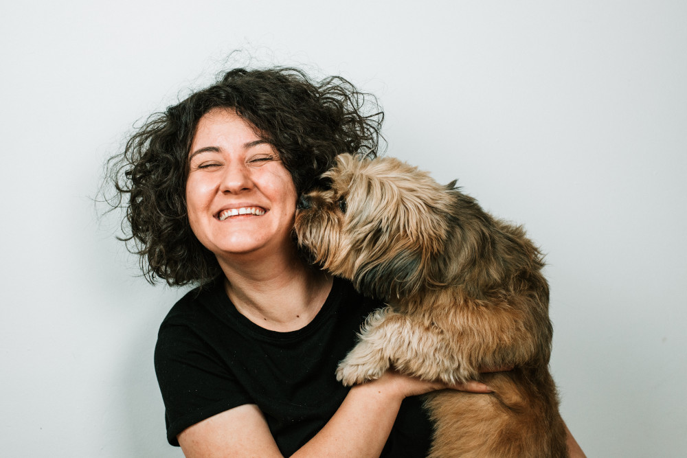 Dog kiss her